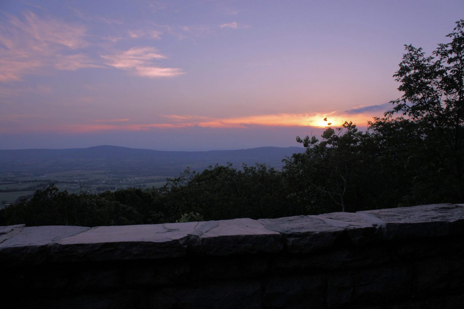 The sun setting over Middletown below at Gambrill State Park